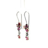 Pair of earrings with pink tourmalines on a white background
