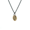 Necklace with a gold pendant featuring vermont with a diamond on the mad river valley
