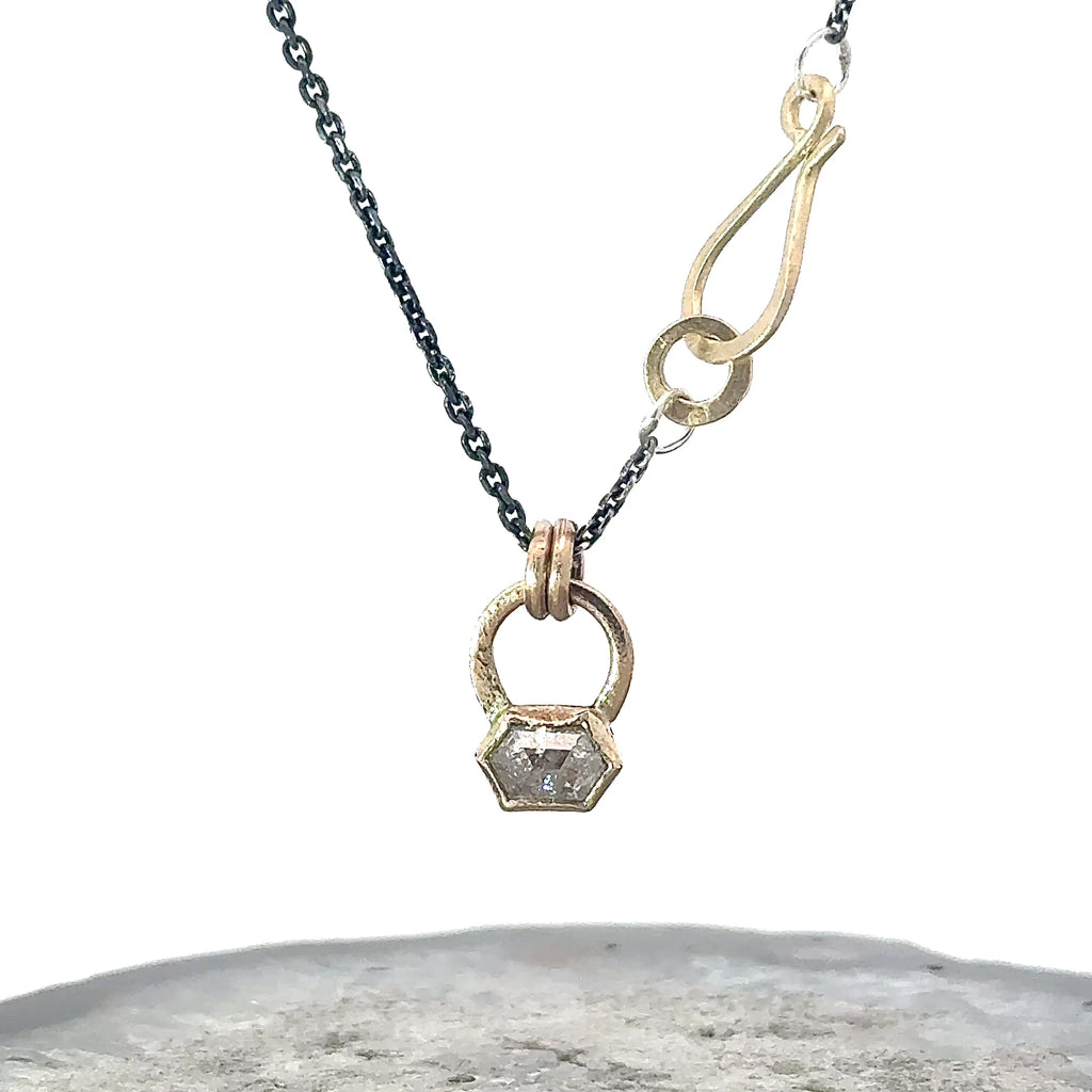 Diamond pendant set in yellow gold